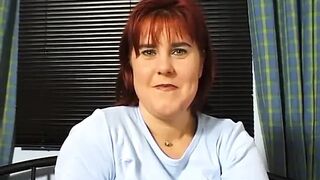 Redhead masturbating with banana