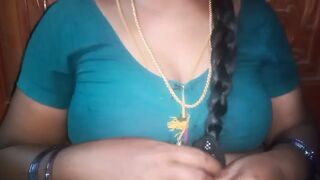Tamil aunty squeezing her breasts when she is alone and unable to control her emotions.