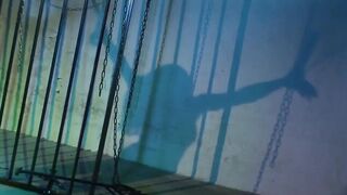 Slutty Brunette in a Cage Gets Fucked in a Double Penetration