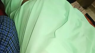My neighbor's aunt was beautiful in a saree on the bed. I gently rubbed her breasts and shared them on the bed.