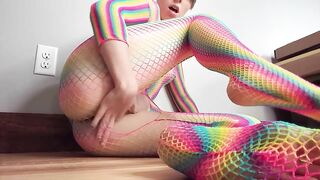 Teen in Rainbow Fishnets Fingers Herself