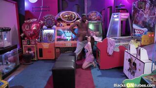 Brunette girlfriend fucked by black bf in public arcade