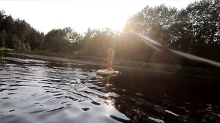 Tattooed Babe Strips and Swims on a SUP Board in the Forest River