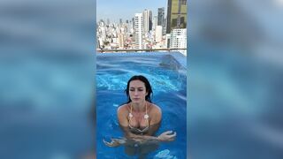 Rooftop Pool Cleavage Tease in Tiny Bikini