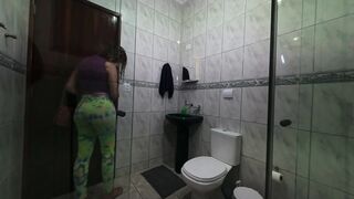 Maid changing clothes in the bathroom.