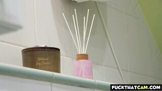 Redhead MILF teases her stepson while taking a shower.