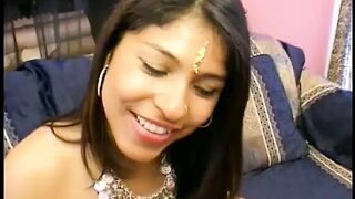 Lusty brunette dressed in Indian Style seduces two horny dudes