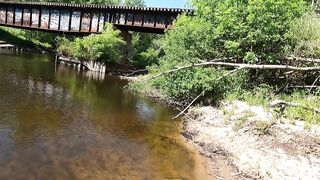 Big-Titted Brunette Gives Public Blowjob by the River!