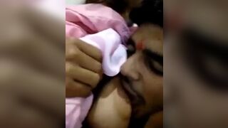 Sister is breastfeeding her brother