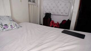 Naked Girl on All fours Uses a Massive Dildo with a Pink Strap